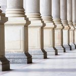 Row of classical Columns with copy space, Czech Republic Closeup bases row of marble columns. Symbols of integrity, stability, and trustworthiness. Closeup row of classical marble columns. Detail of Mlynska colonnade Karlovy Vary Czech republic establish 1881, this is the biggest colonnade in Karlovy Vary. Full frame horizontal composition with copy space