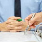 business man and woman checking proposal of contract business man and woman checking proposal of contract