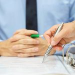 business man and woman checking proposal of contract